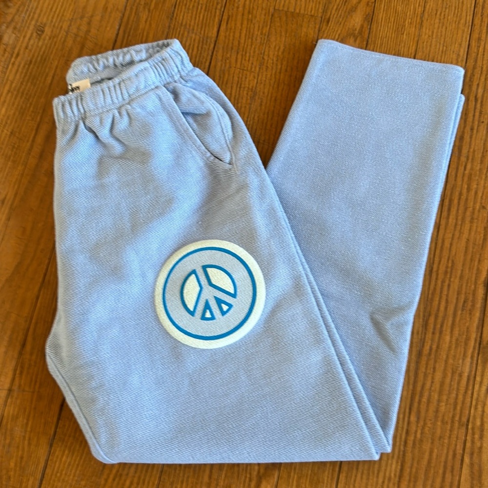 Madhappy Light Blue Track Pants with Peace Symbol